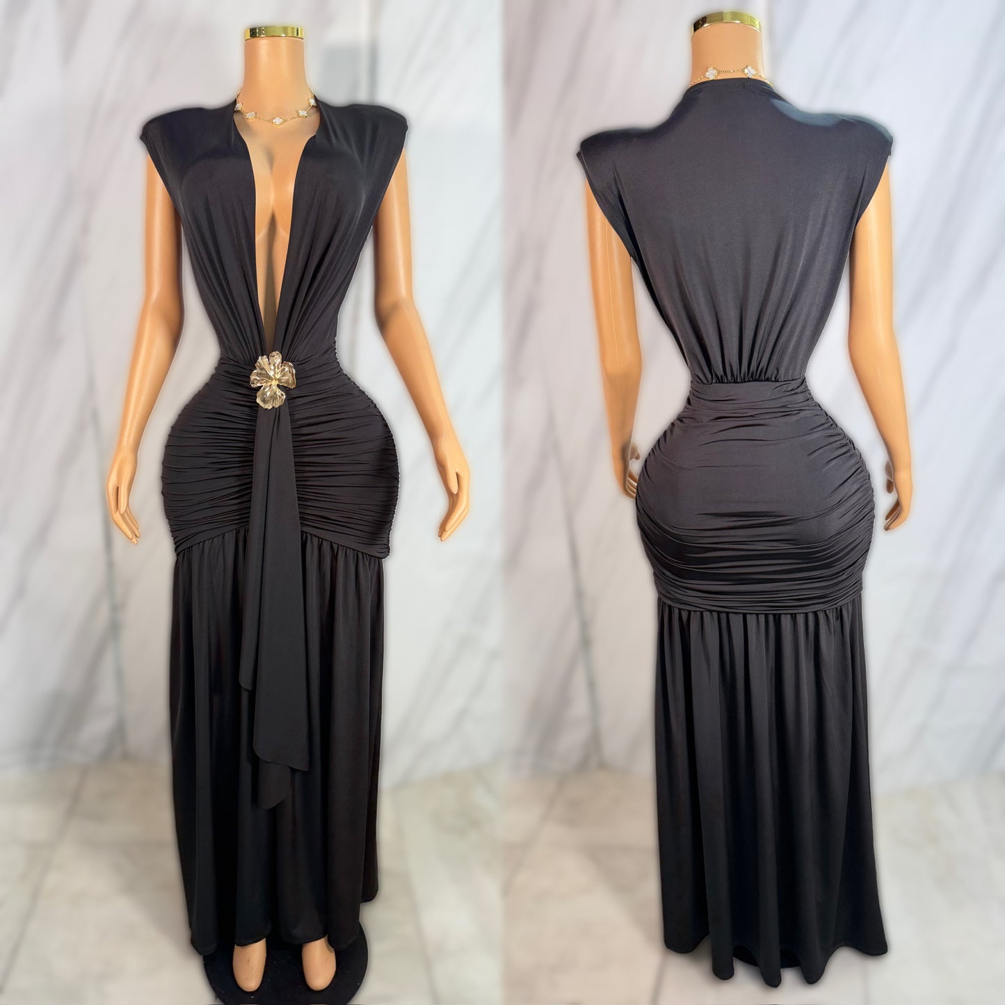 Vestido negro broche dorado