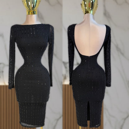 Vestido negro pedrería escote